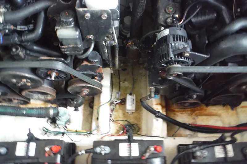 Slide: The Image of Engine compartment of a 2007 Sea Ray 290 SLX boat, showing belts and batteries. - 35