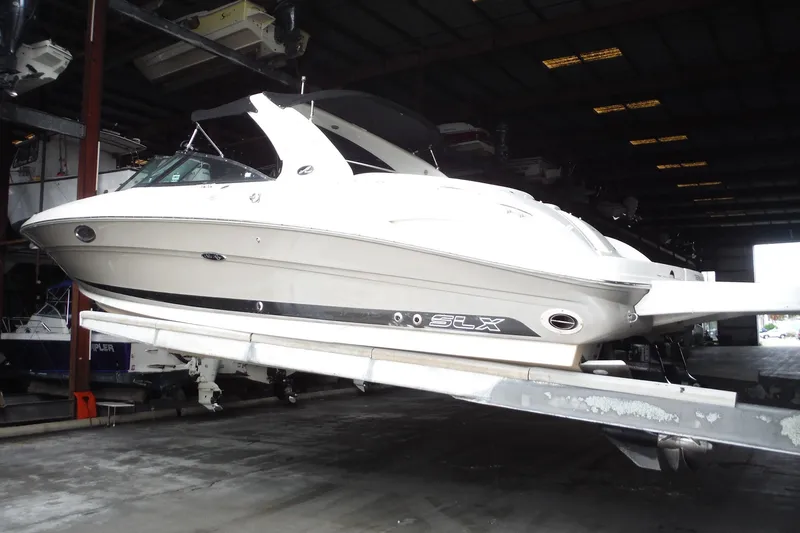 Slide: The Image of 2007 Sea Ray 290 SLX boat in storage facility, side view. - 3