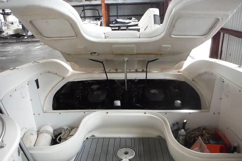 Slide: The Image of 2007 Sea Ray 290 SLX boat engine compartment with open hatch, showcasing dual engines. - 36