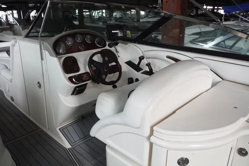 Slide: The Image of 2007 Sea Ray 290 SLX boat interior with steering wheel and dashboard controls. - 14