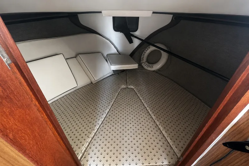 Slide: The Image of 1972 Luhrs 32 Convertible boat interior with cushioned seating and life preserver. - 10