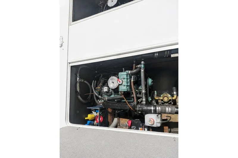 Slide: The Image of Engine compartment of a 1972 Luhrs 32 Convertible boat, showcasing mechanical components. - 15