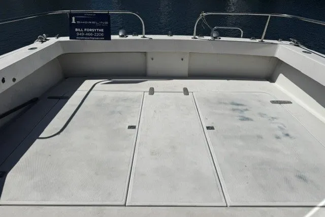 Slide: The Image of 1972 Luhrs 32 Convertible boat deck with railing and storage compartments. - 4