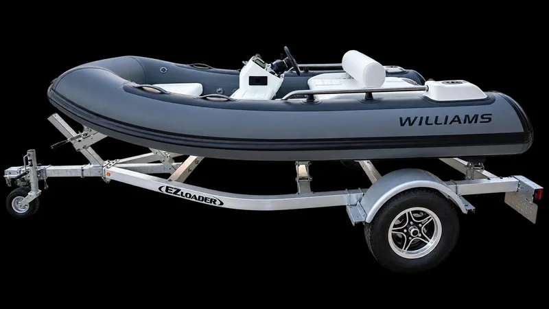 The Image of A 2022 Williams Jet Tenders Sportjet 345 on a trailer, featuring a gray hull and white seating. - 0