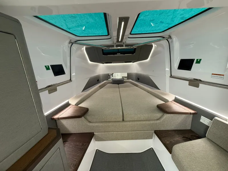 Slide: The Image of Interior of the 2023 Axopar Brabus 37 XC Cross Cabin with modern design and comfortable seating. - 26