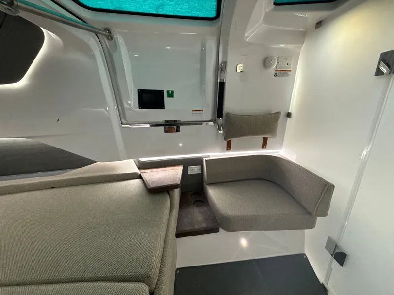 Slide: The Image of Interior of the Axopar Brabus 37 XC Cross Cabin with gray upholstery and modern design. - 30