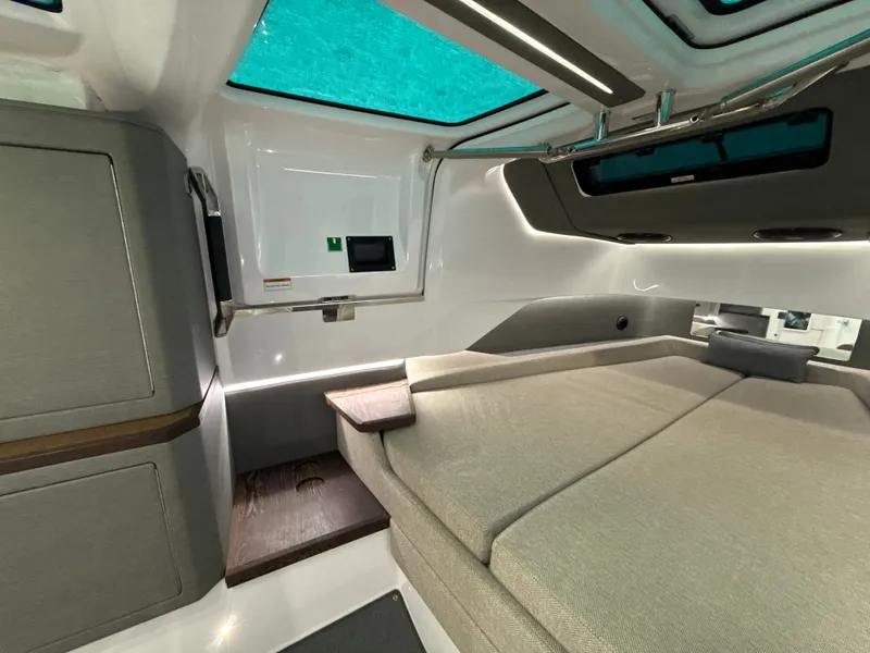 Slide: The Image of Interior of the 2023 Axopar Brabus 37 XC Cross Cabin with modern design and comfortable sleeping area. - 27