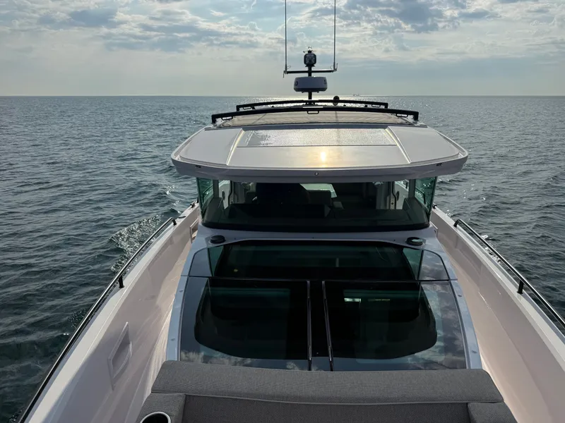 Slide: The Image of The image shows a 2023 Axopar Brabus 37 XC Cross Cabin on the sea. - 17