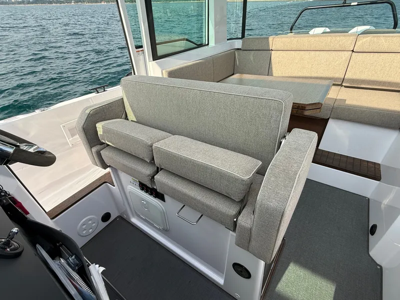 Slide: The Image of The image shows the interior of a 2023 Axopar Brabus 37 XC Cross Cabin with gray upholstery. - 21