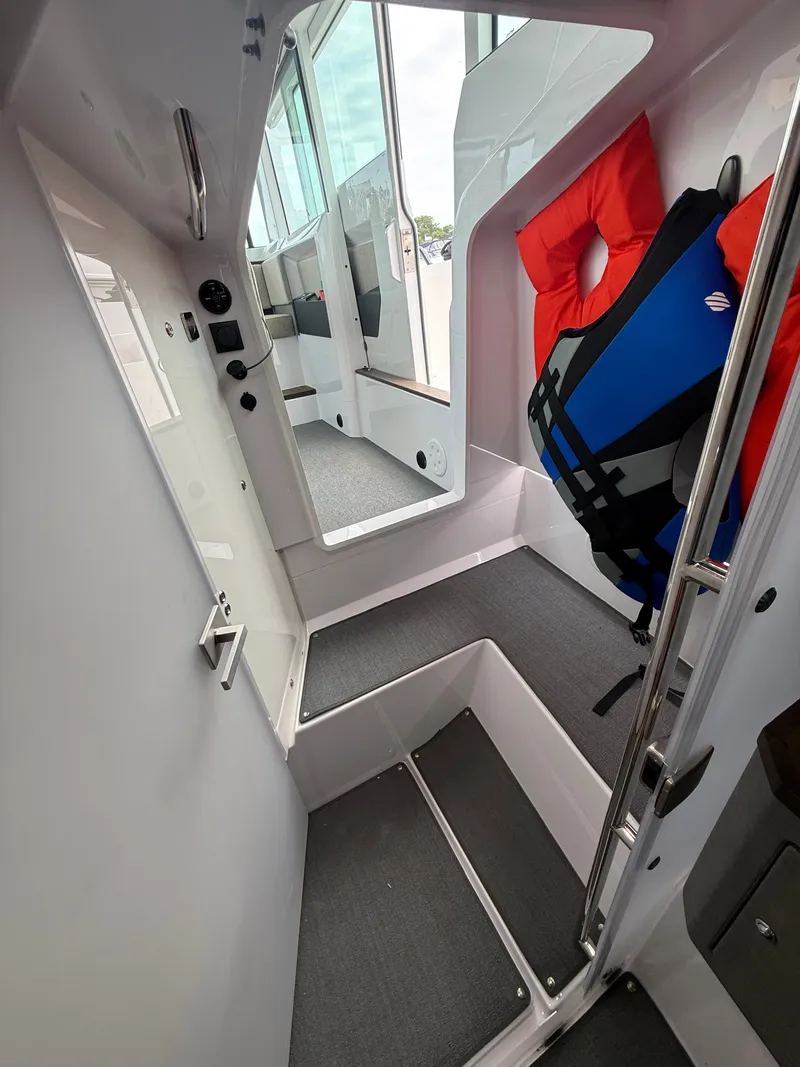 Slide: The Image of Interior of the Axopar Brabus 37 XC Cross Cabin with a life jacket. - 31