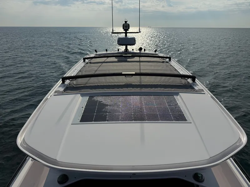 Slide: The Image of The image shows the roof of a 2023 Axopar Brabus 37 XC Cross Cabin with solar panels on the sea. - 38