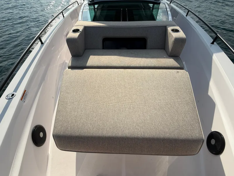 Slide: The Image of The image shows the sun deck of a 2023 Axopar Brabus 37 XC Cross Cabin. - 18