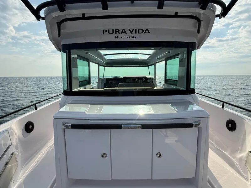 Slide: The Image of The 2023 Axopar Brabus 37 XC Cross Cabin features a modern cabin with large windows. - 10