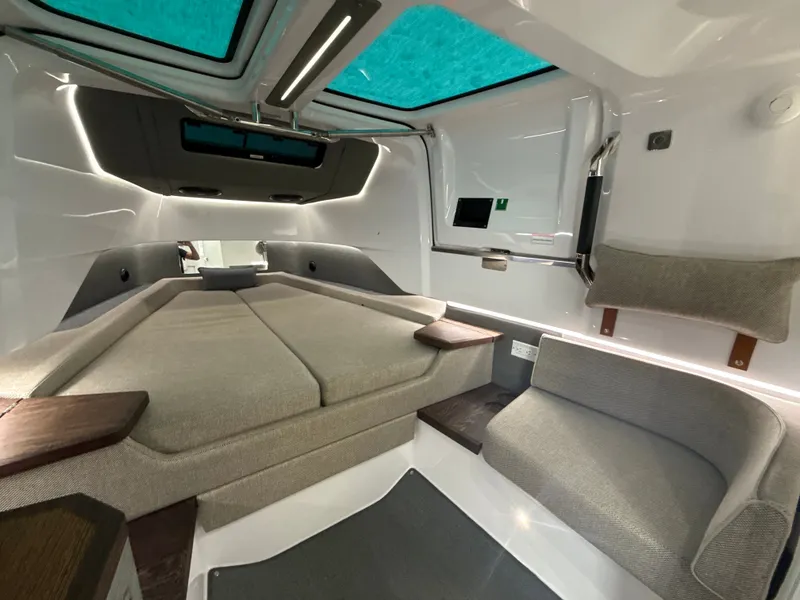 Slide: The Image of Interior of the 2023 Axopar Brabus 37 XC Cross Cabin with modern seating and panoramic windows. - 28