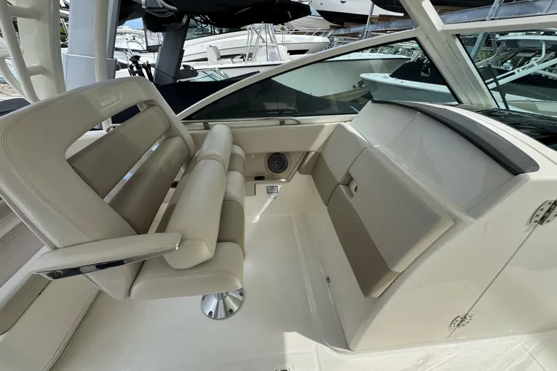 Slide: The Image of 2021 Boston Whaler 320 Vantage interior with beige seating and modern design. - 74