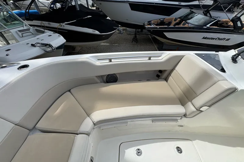 Slide: The Image of 2021 Boston Whaler 320 Vantage boat interior with beige seating and sleek design. - 81