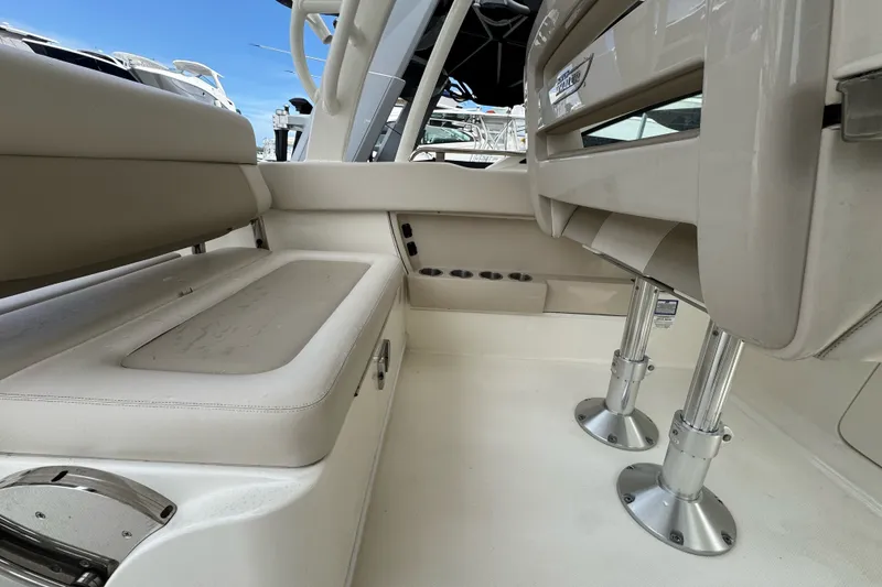 Slide: The Image of Interior view of a 2021 Boston Whaler 320 Vantage boat, featuring seating and storage. - 56
