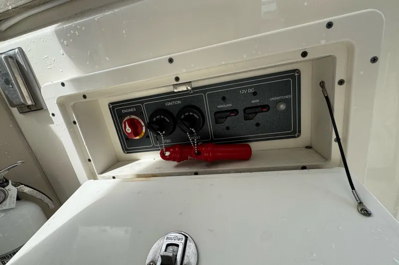 Slide: The Image of Control panel of a 2021 Boston Whaler 320 Vantage boat with ignition switches. - 51