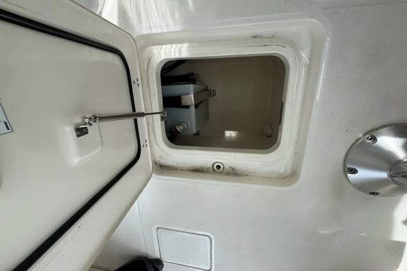 Slide: The Image of Open storage compartment on a 2021 Boston Whaler 320 Vantage boat interior. - 64