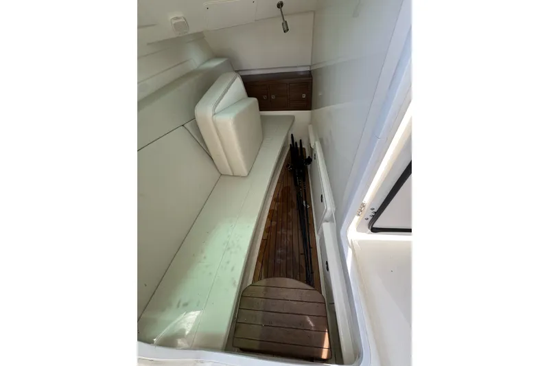 Slide: The Image of Interior cabin of 2021 Boston Whaler 320 Vantage with seating and storage. - 70