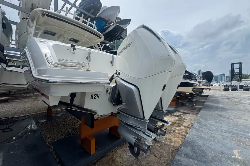 Slide: The Image of 2021 Boston Whaler 320 Vantage boat with dual Mercury outboard engines on display. - 13
