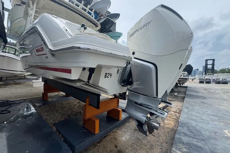 Slide: The Image of 2021 Boston Whaler 320 Vantage boat with Mercury outboard engine on display. - 14