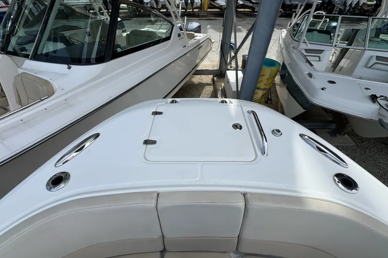 Slide: The Image of 2021 Boston Whaler 320 Vantage boat deck with seating and storage compartments. - 82