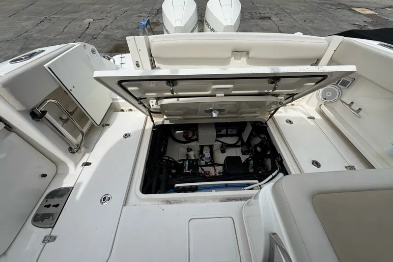 Slide: The Image of 2021 Boston Whaler 320 Vantage boat interior with open engine compartment. - 40