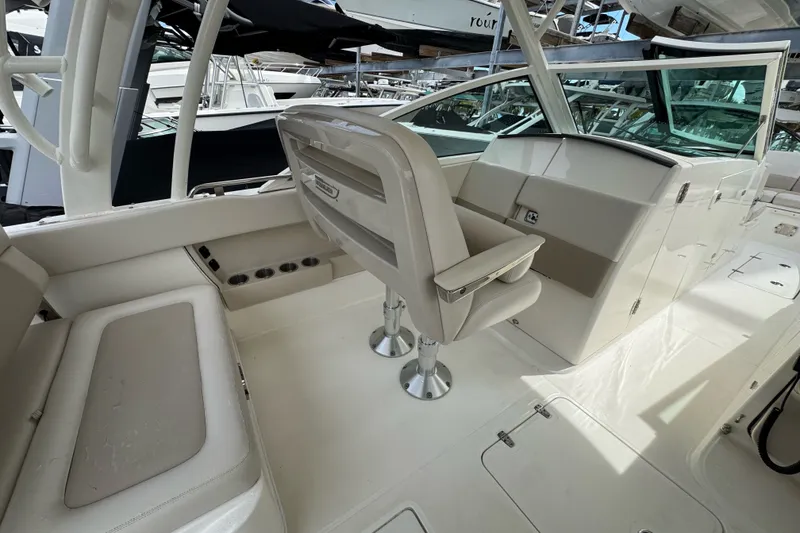 Slide: The Image of 2021 Boston Whaler 320 Vantage interior with seating and helm, showcasing luxury design. - 57