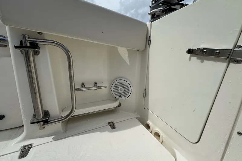 Slide: The Image of 2021 Boston Whaler 320 Vantage interior detail with speaker and stainless steel railing. - 41