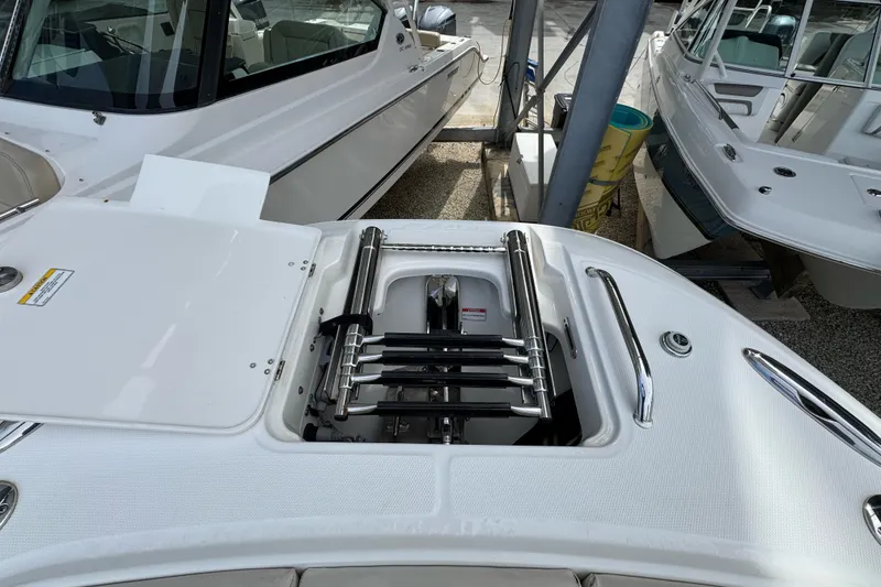 Slide: The Image of 2021 Boston Whaler 320 Vantage boat with open hatch and stainless steel ladder. - 83
