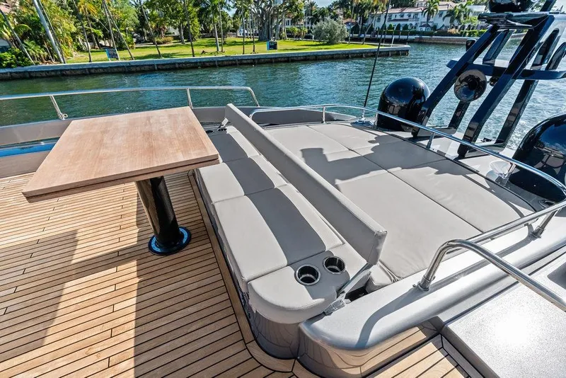 Slide: The Image of Luxury deck of 2025 Pershing GTX 80 yacht with seating and table. - 32