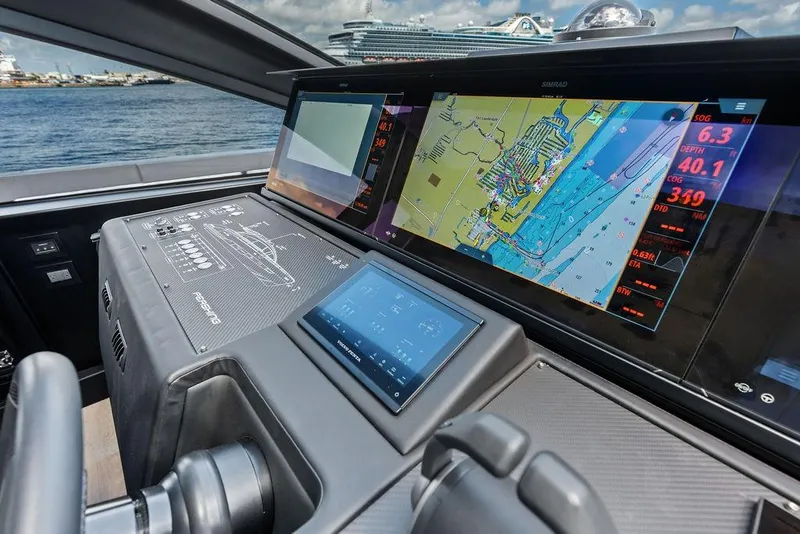 Slide: The Image of Cockpit of 2025 Pershing GTX 80 yacht with advanced navigation displays. - 57