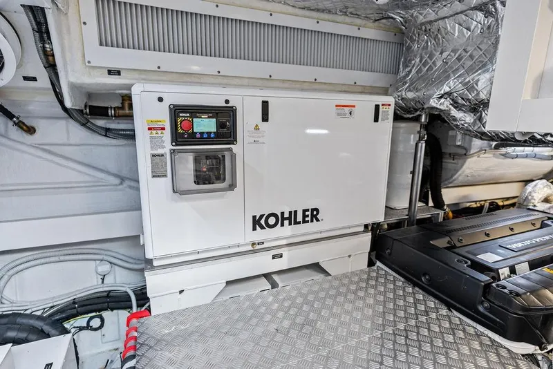 Slide: The Image of Engine room of 2025 Pershing GTX 80 yacht featuring Kohler generator. - 93