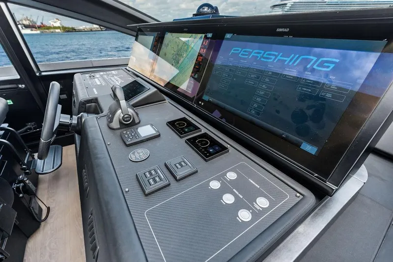 Slide: The Image of Cockpit of 2025 Pershing GTX 80 yacht with advanced navigation displays and controls. - 64