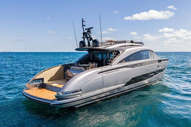 Slide: The Image of 2025 Pershing GTX 80 yacht cruising on open sea under clear blue sky. - 15