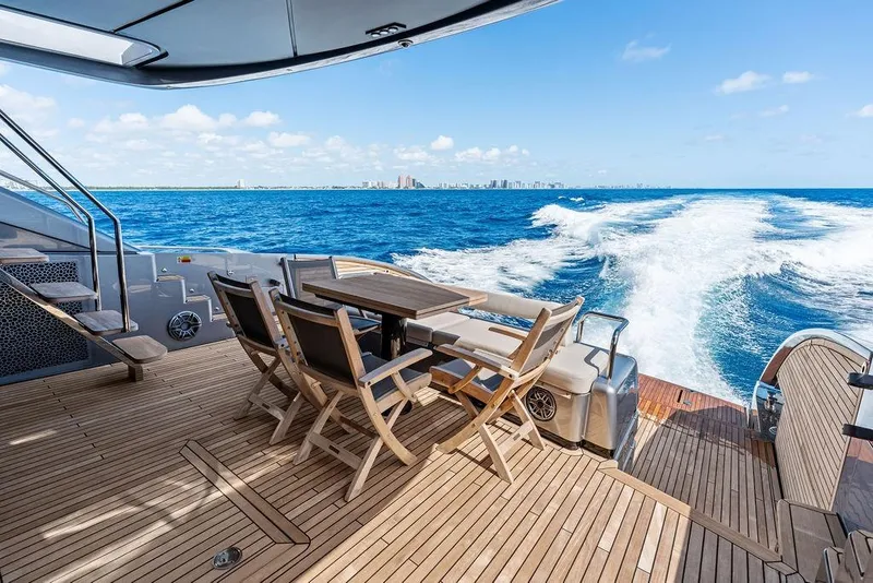 Slide: The Image of Luxurious 2025 Pershing GTX 80 yacht deck with ocean view and city skyline. - 43