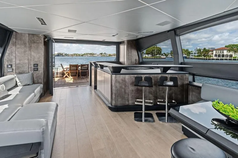 Slide: The Image of Luxurious interior of 2025 Pershing GTX 80 yacht with modern seating and waterfront view. - 56