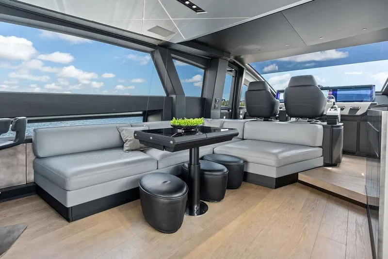Slide: The Image of Luxurious interior of 2025 Pershing GTX 80 yacht with modern seating and panoramic windows. - 61