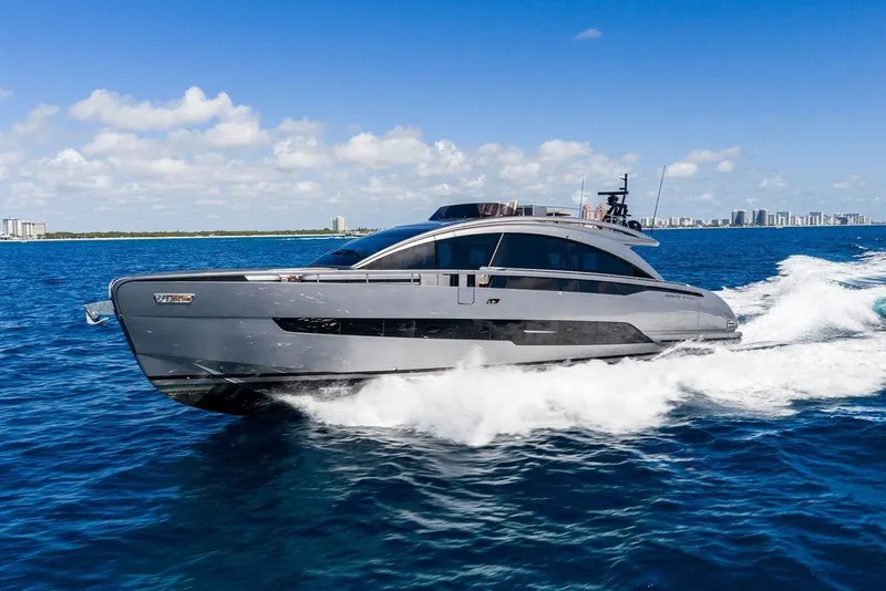 Slide: The Image of 2025 Pershing GTX 80 yacht cruising on blue ocean under clear sky. - 24