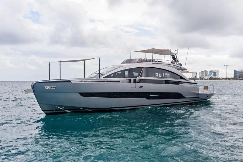 Slide: The Image of Luxury 2025 Pershing GTX 80 yacht cruising on open water under cloudy skies. - 3