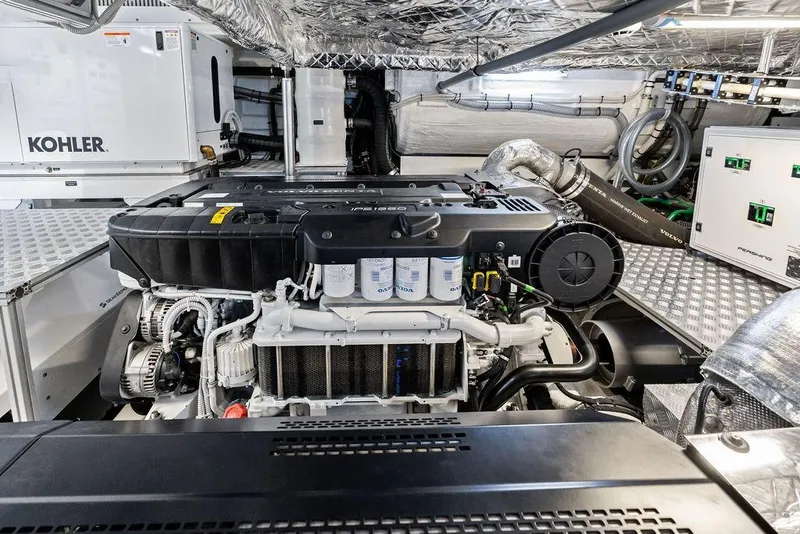 Slide: The Image of Engine room of 2025 Pershing GTX 80 yacht, featuring advanced machinery and equipment. - 105