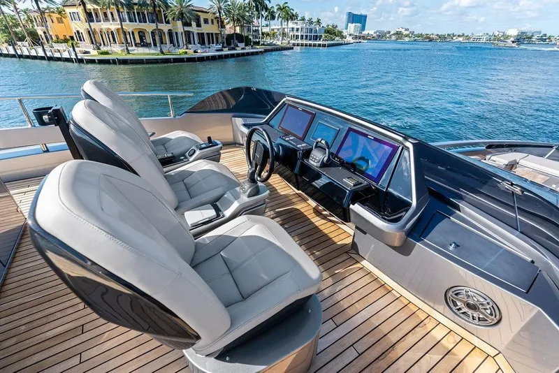 Slide: The Image of Luxurious 2025 Pershing GTX 80 yacht cockpit with modern controls and waterfront view. - 39