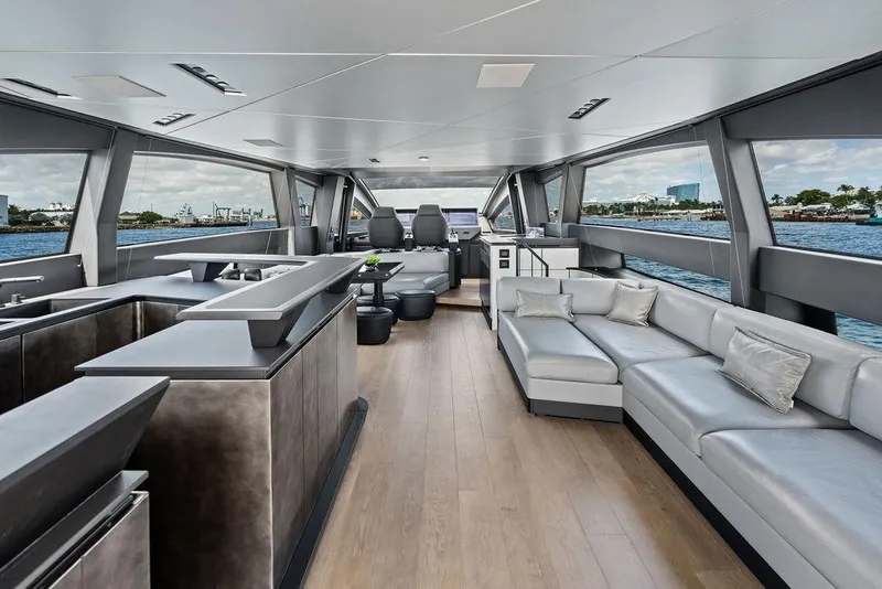 Slide: The Image of Luxurious interior of 2025 Pershing GTX 80 yacht with modern seating and panoramic windows. - 58