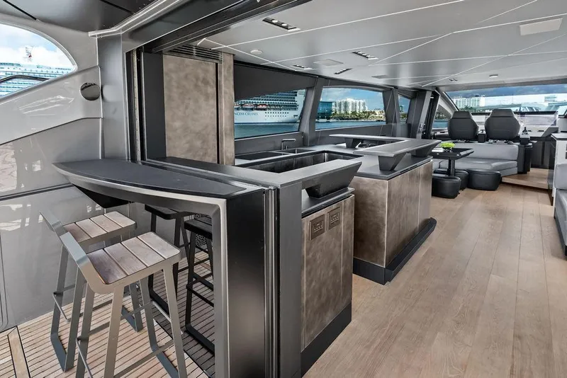 Slide: The Image of Luxurious interior of 2025 Pershing GTX 80 yacht with modern bar and seating area. - 52
