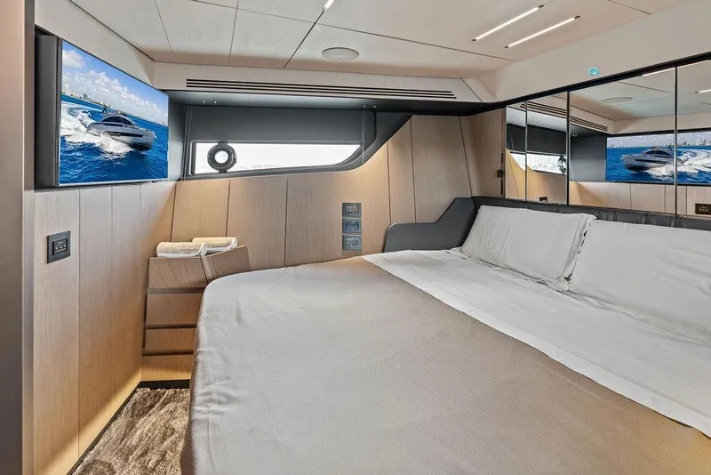 Slide: The Image of Luxurious interior of 2025 Pershing GTX 80 yacht bedroom with modern design and large bed. - 79