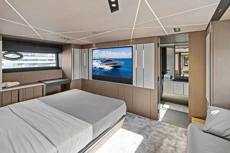 Slide: The Image of Luxurious interior of 2025 Pershing GTX 80 yacht with modern bedroom and ensuite bathroom. - 74