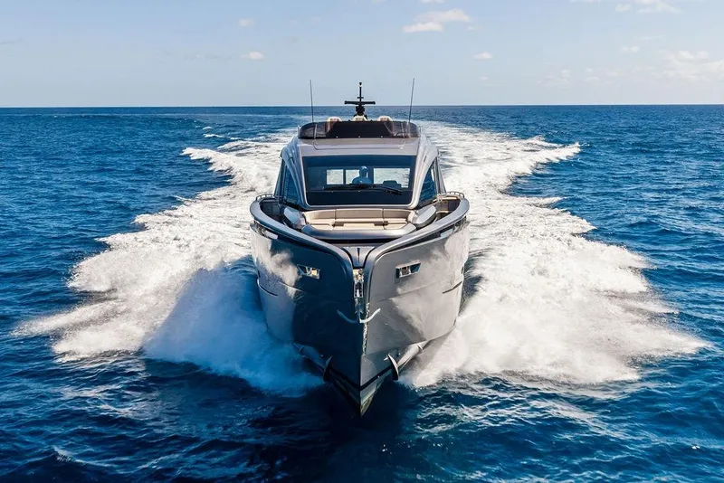 Slide: The Image of 2025 Pershing GTX 80 yacht cruising on open sea, leaving a wake. - 21