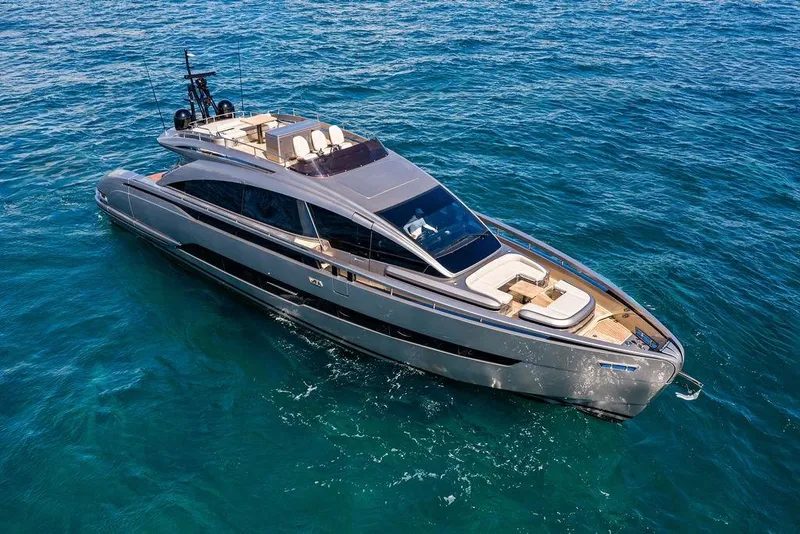 Slide: The Image of Luxurious 2025 Pershing GTX 80 yacht cruising on clear blue ocean waters. - 17
