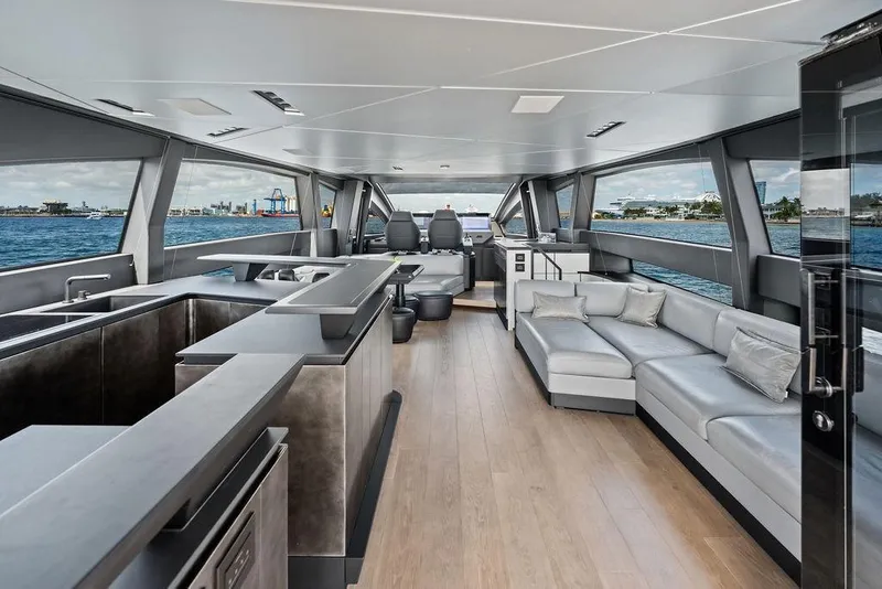 Slide: The Image of Luxurious interior of 2025 Pershing GTX 80 yacht with modern seating and panoramic windows. - 59
